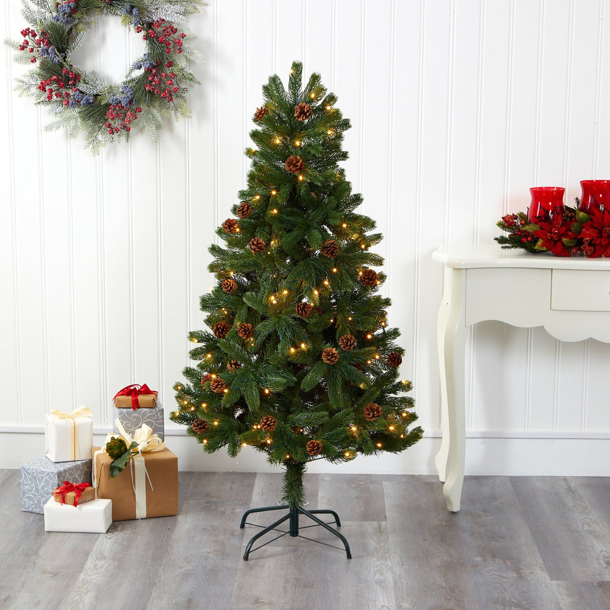 a christmas tree with lights and presents