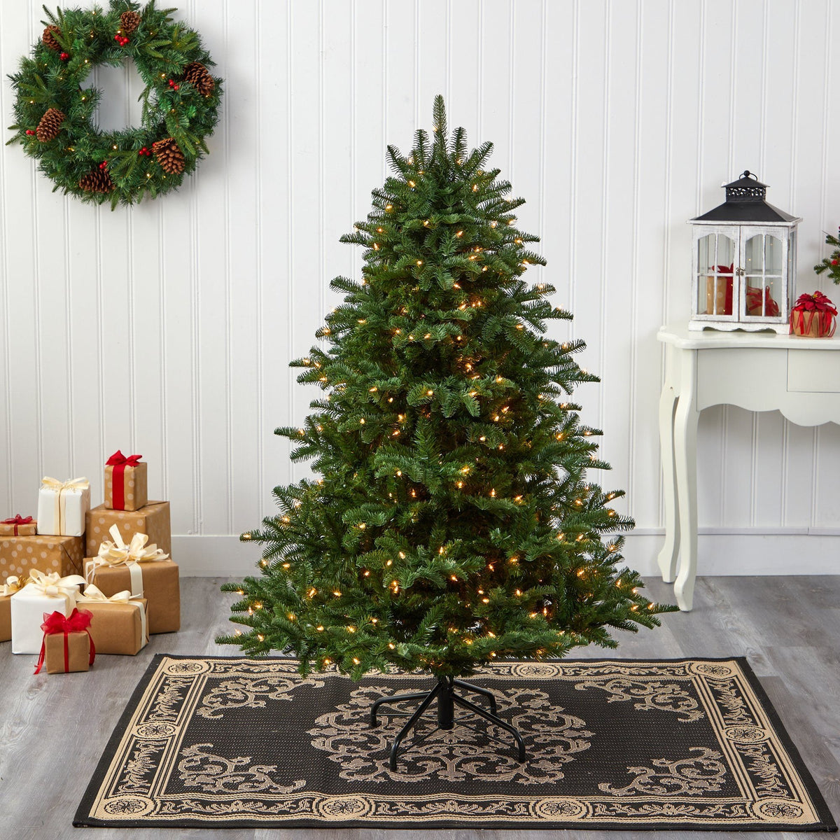 a christmas tree with lights and presents
