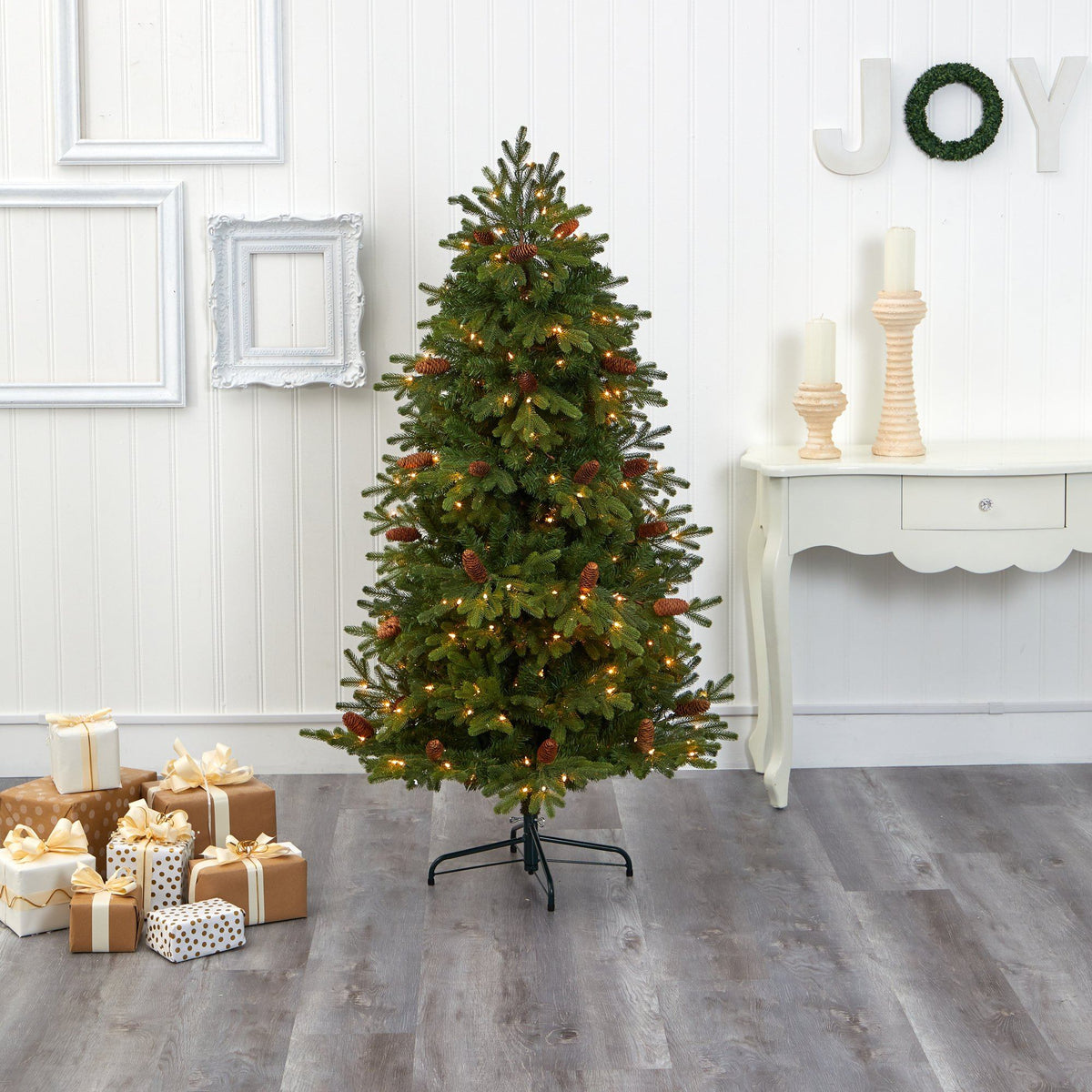 a christmas tree with lights and presents