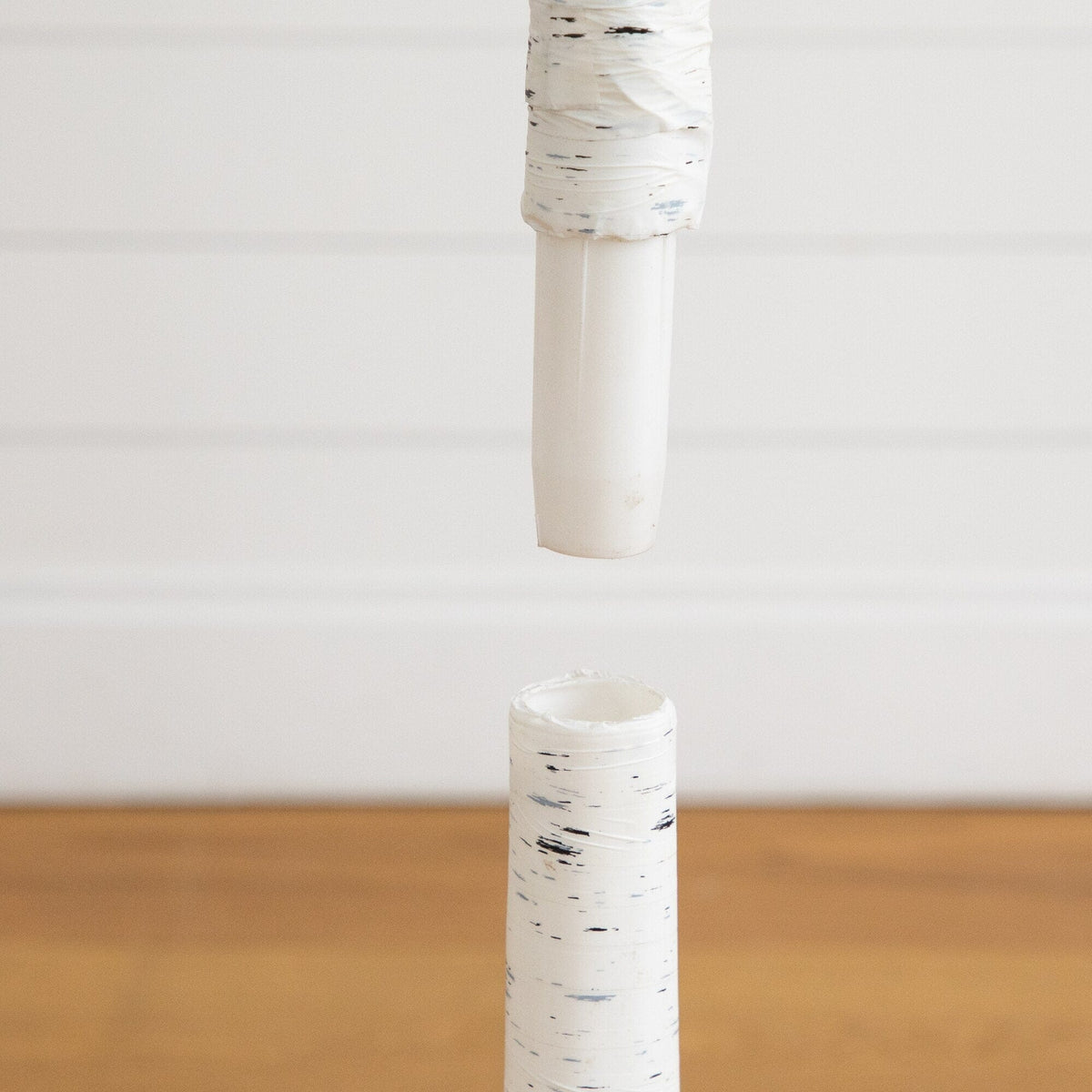 a white tube with a white tape on it