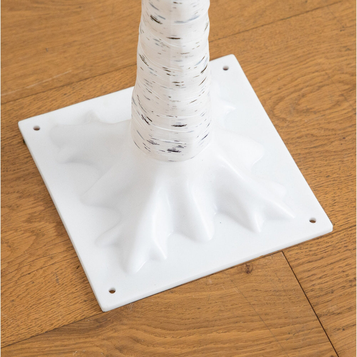 a white plastic tree trunk