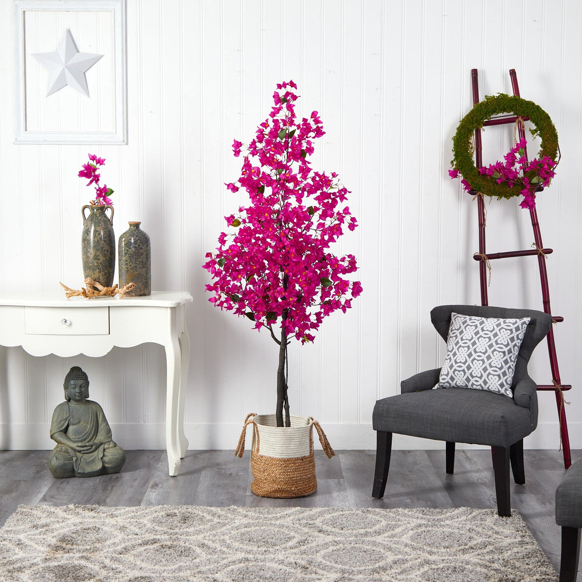 a room with a pink tree and a chair