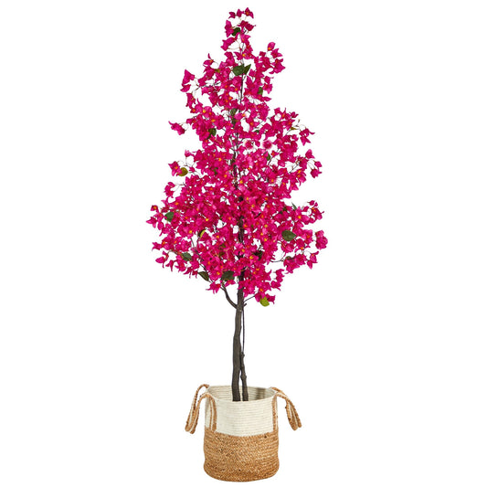 a tree with pink flowers in a basket
