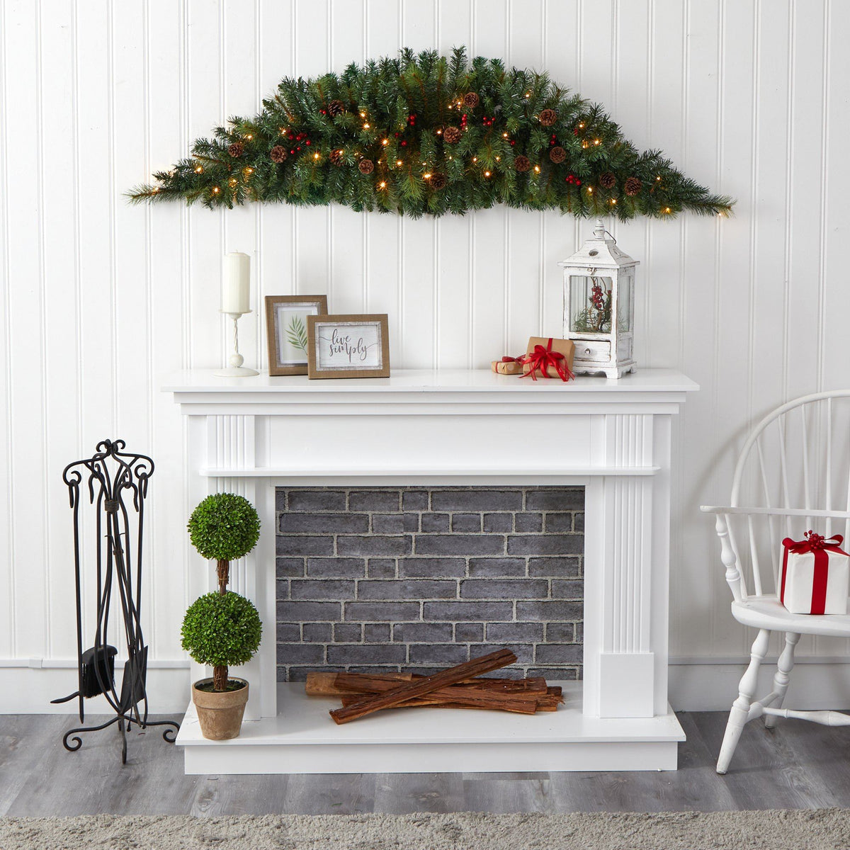 a fireplace with a christmas tree and decorations
