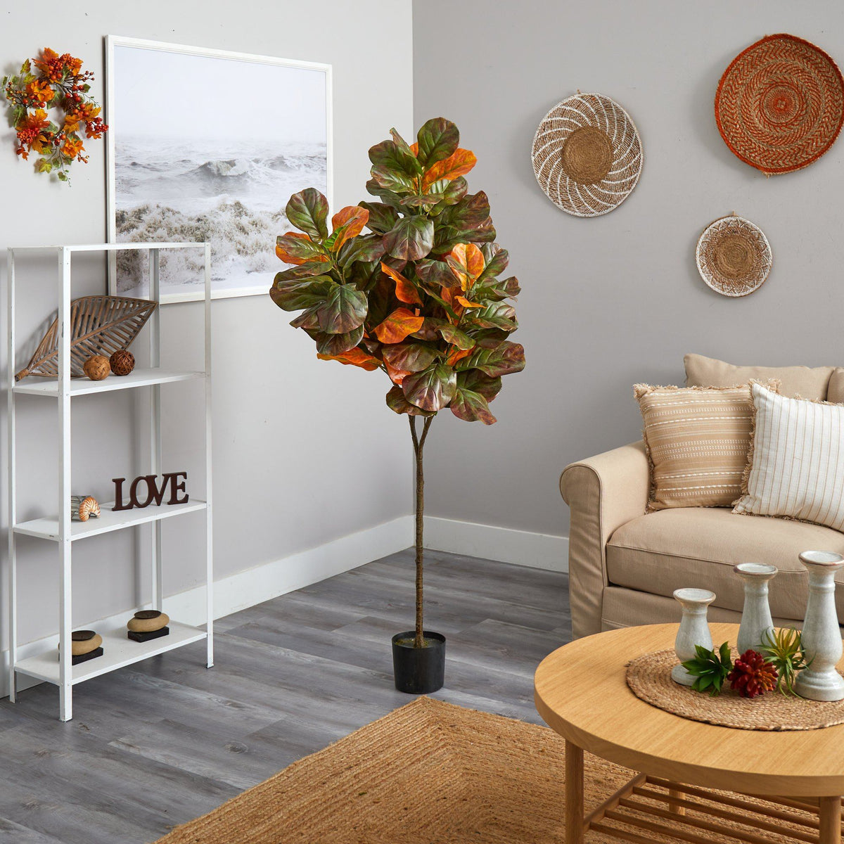 a living room with a couch and a plant