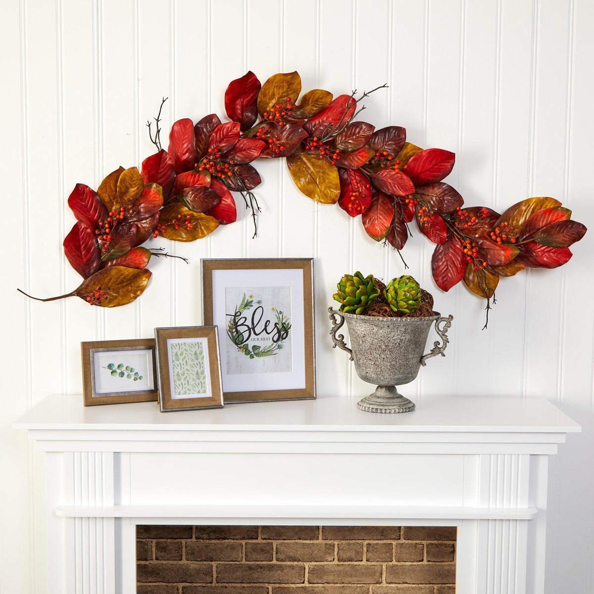 a fireplace with a planter and a picture frame