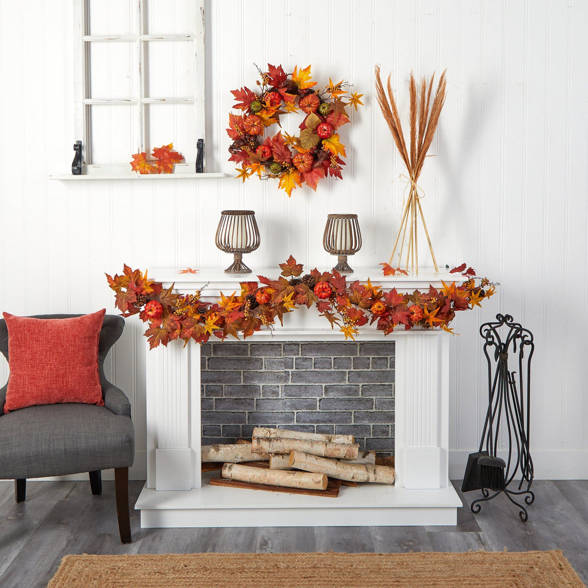 a fireplace with fall leaves on the mantle