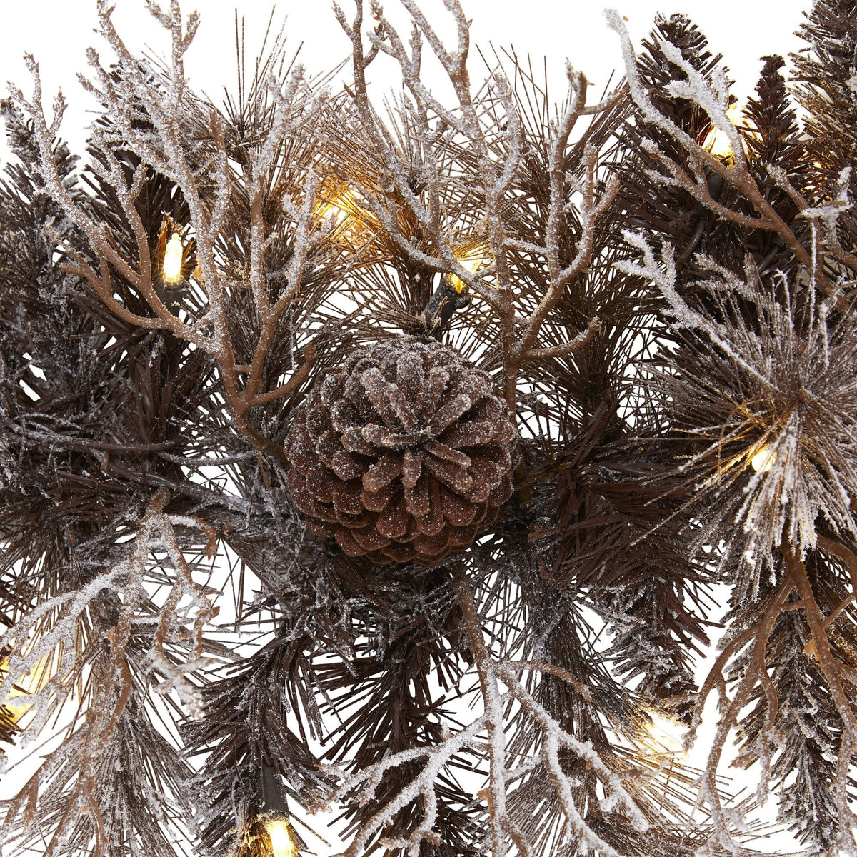 a pinecone and pine needles with lights