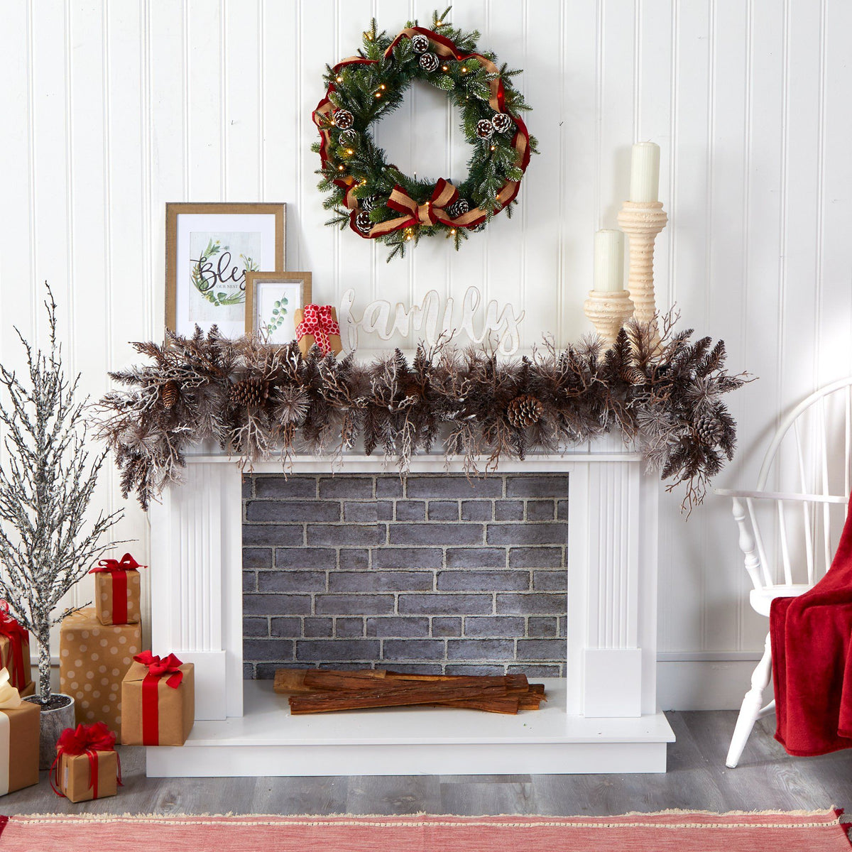 a fireplace with a wreath and presents