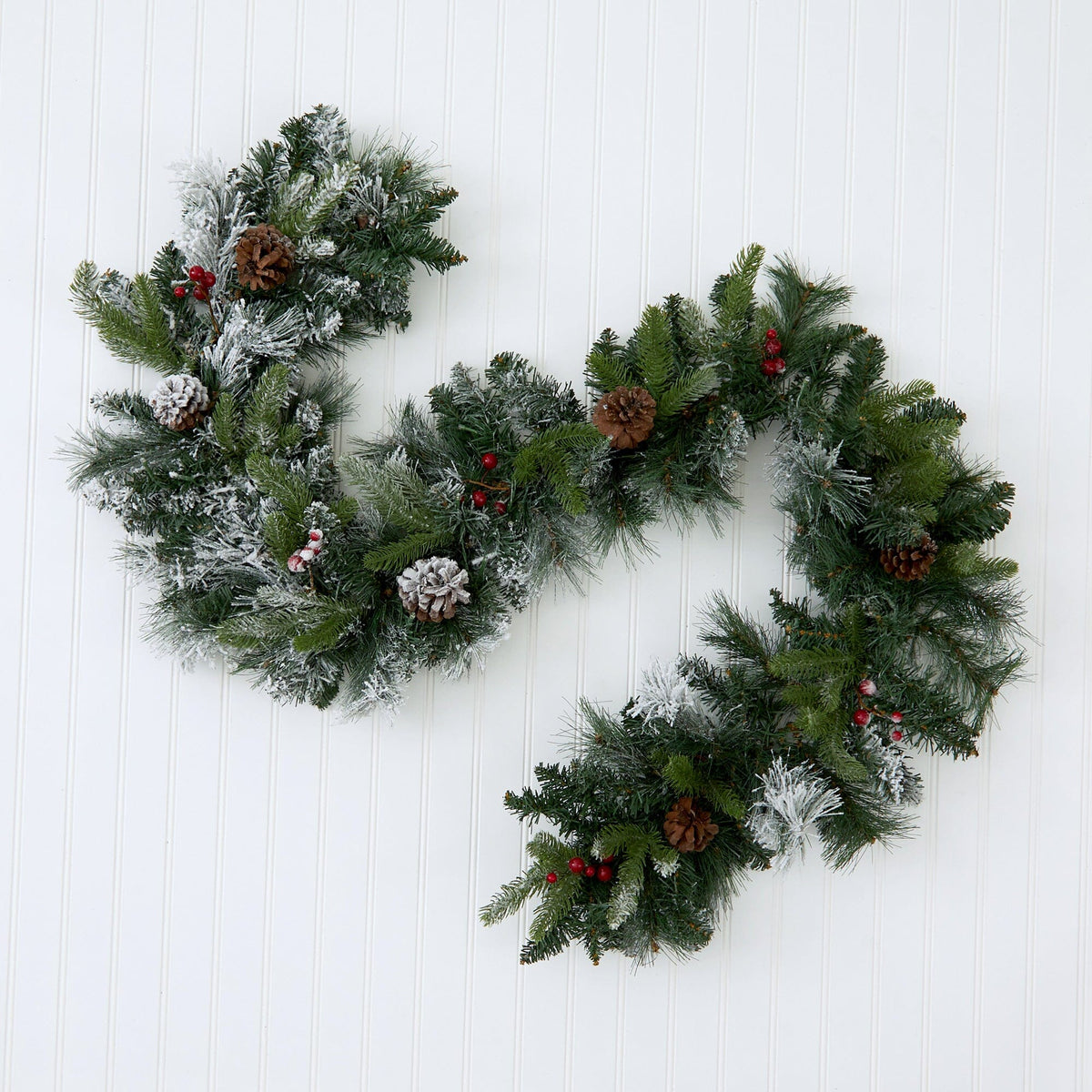a christmas wreath on a white surface
