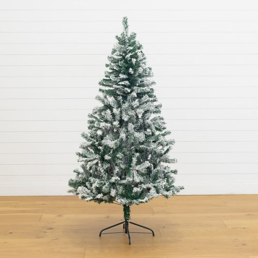 a christmas tree on a wood floor