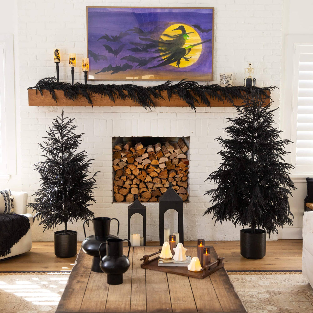 a room with a fireplace and a painting