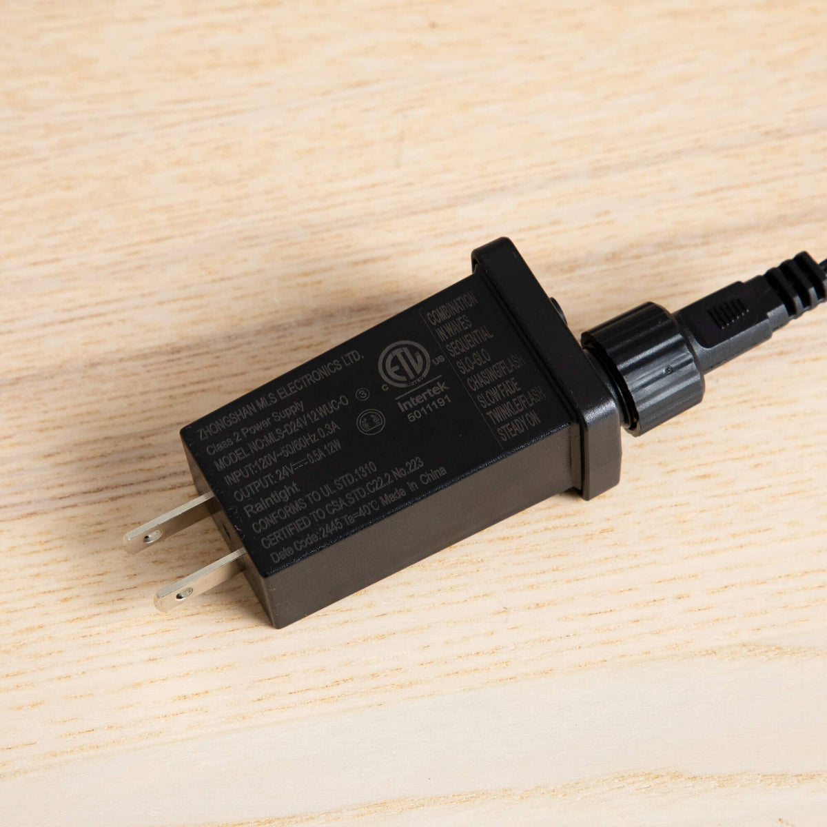 a black power cord with a plug
