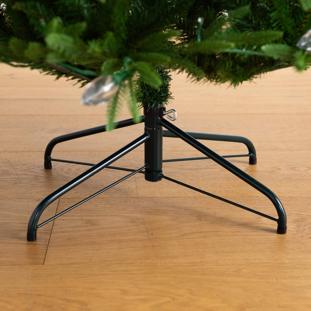 a christmas tree on a wood floor