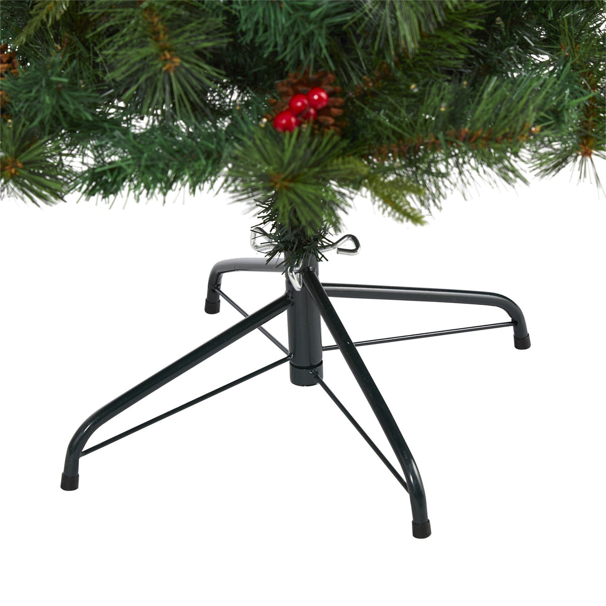 a christmas tree with red berries and a metal base