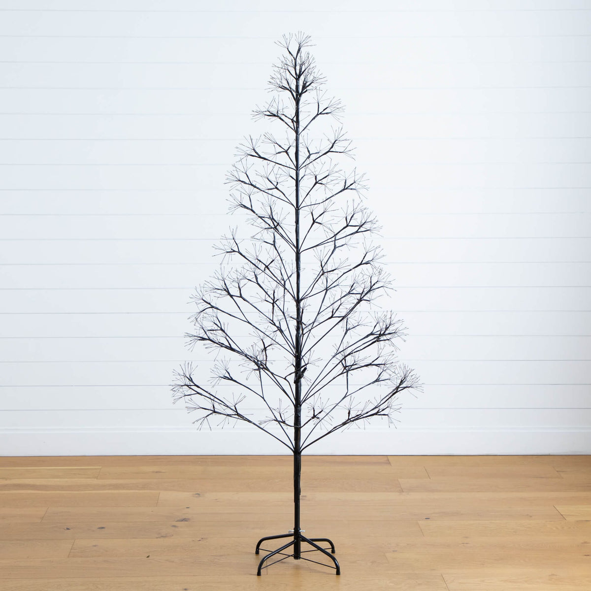 a tree on a wood floor