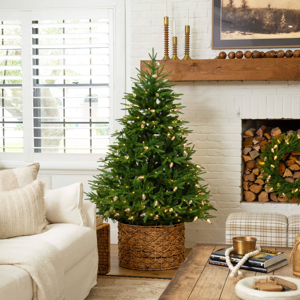 a christmas tree in a basket in a living room