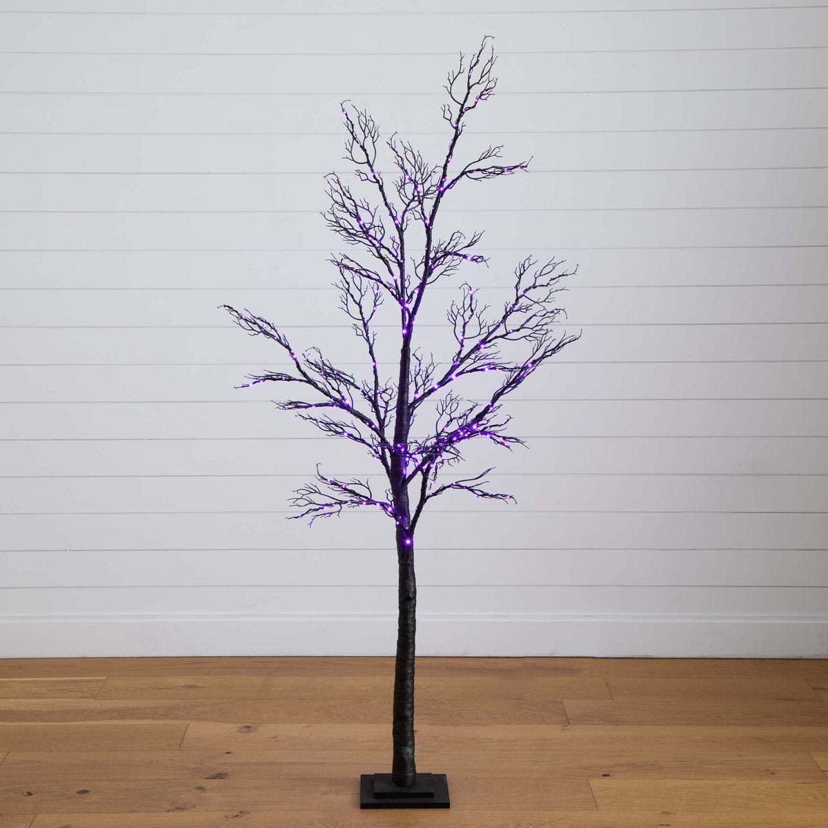 a tree with purple lights