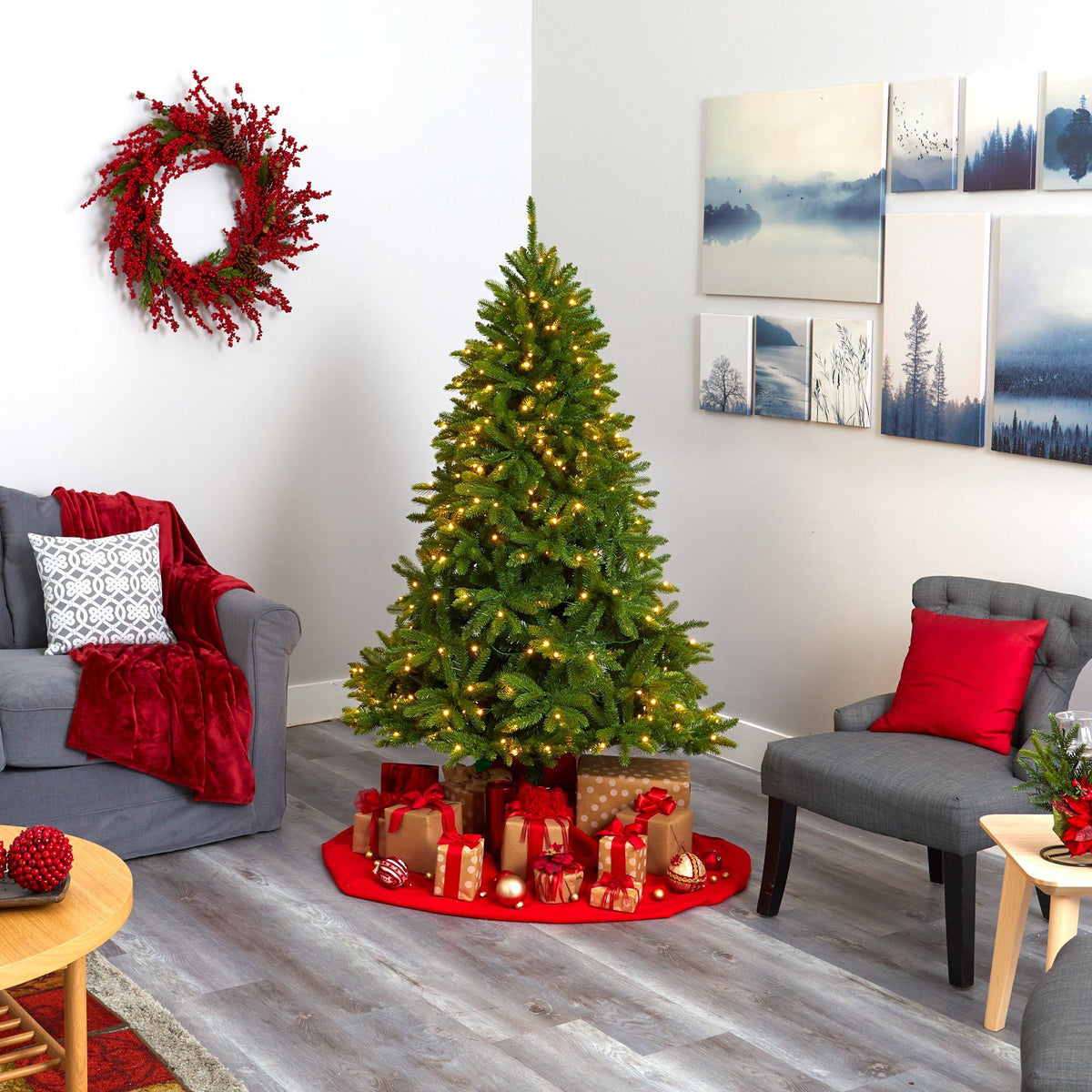 a christmas tree with presents in a room