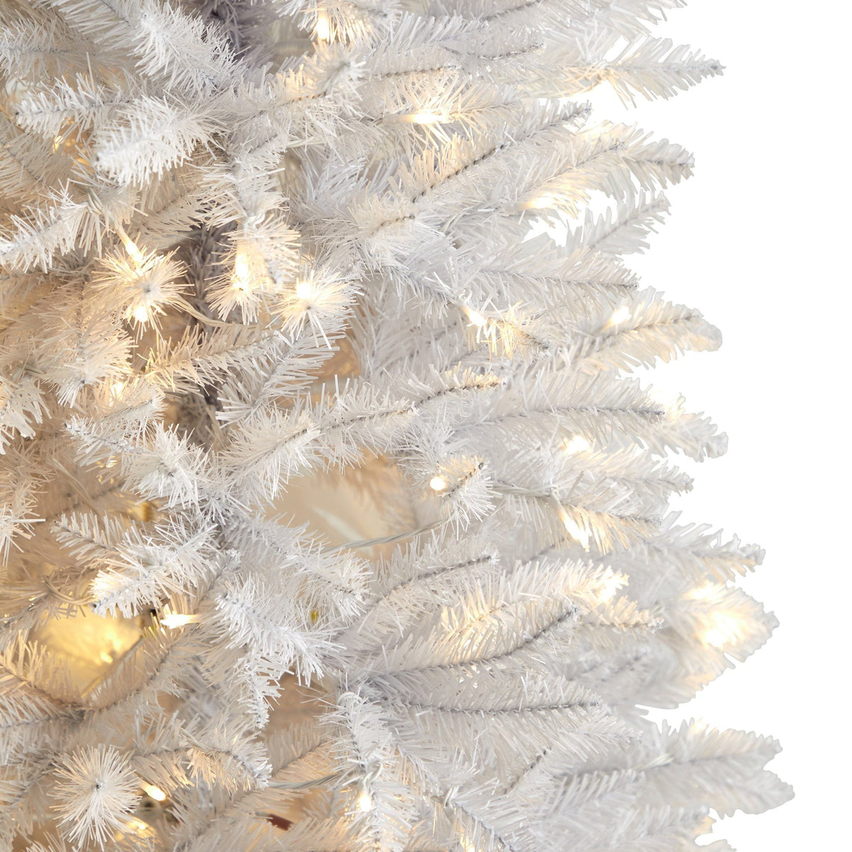 a close up of a white christmas tree