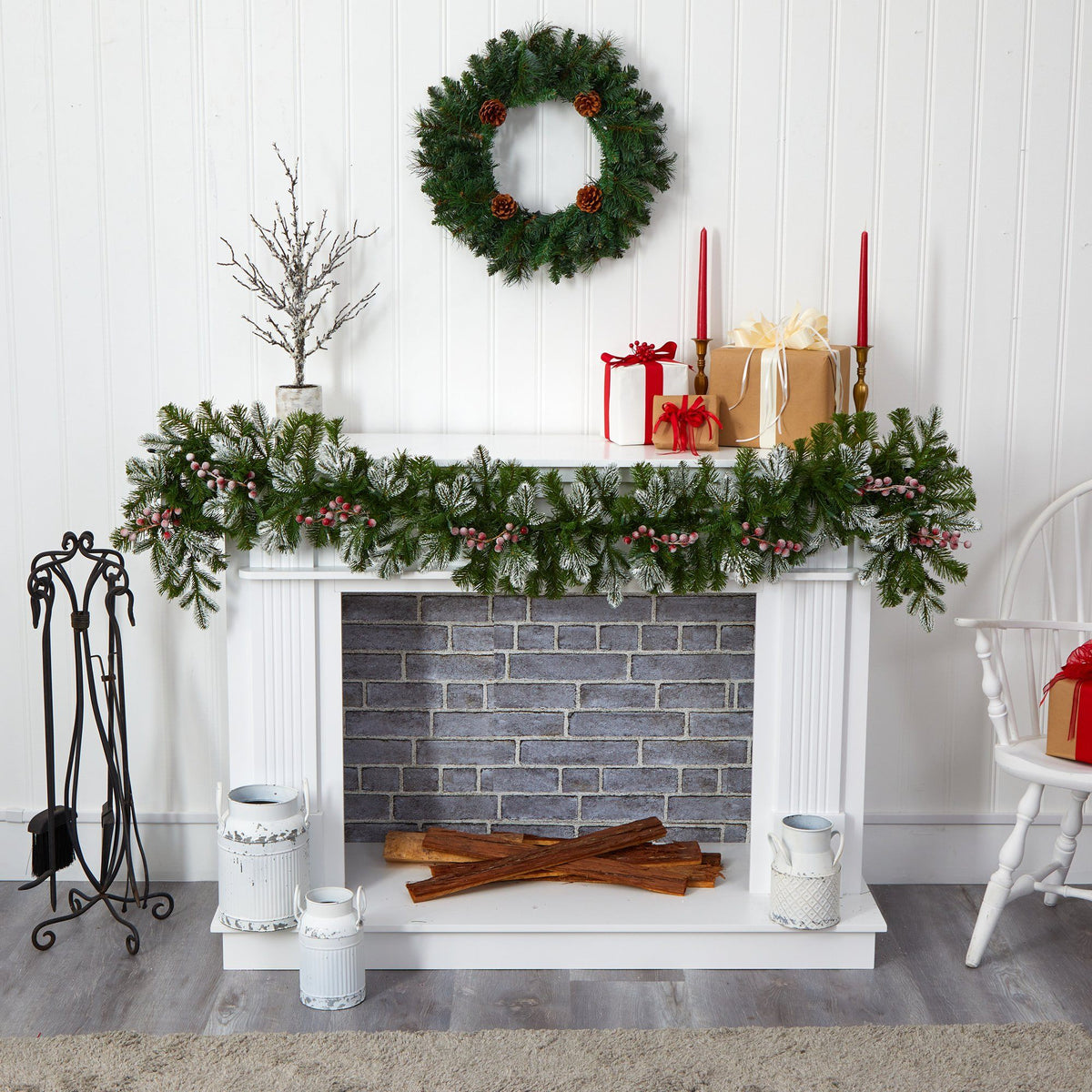 a fireplace with a wreath and a wreath on the wall