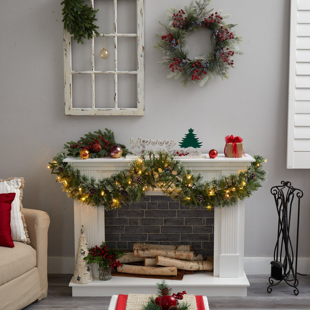 a fireplace with lights and decorations