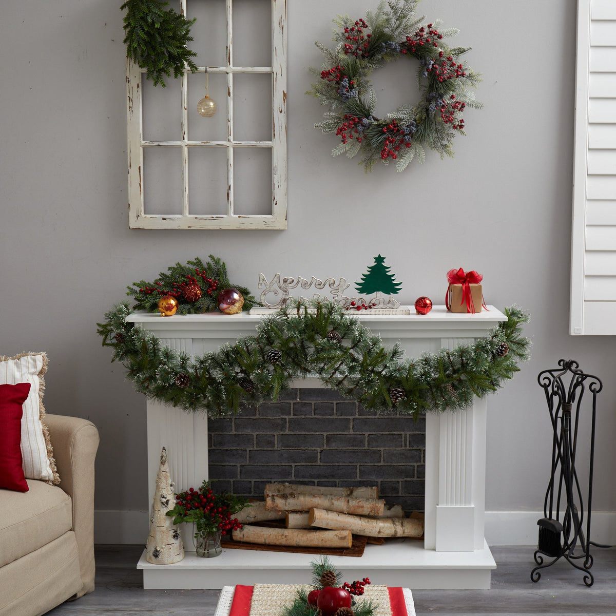a fireplace with wreaths and decorations on the wall