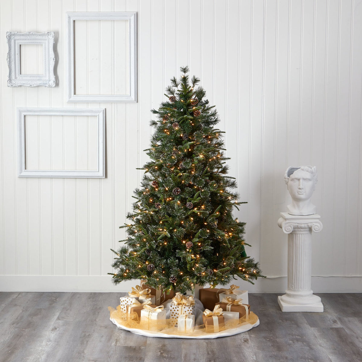 a christmas tree with presents on a stand