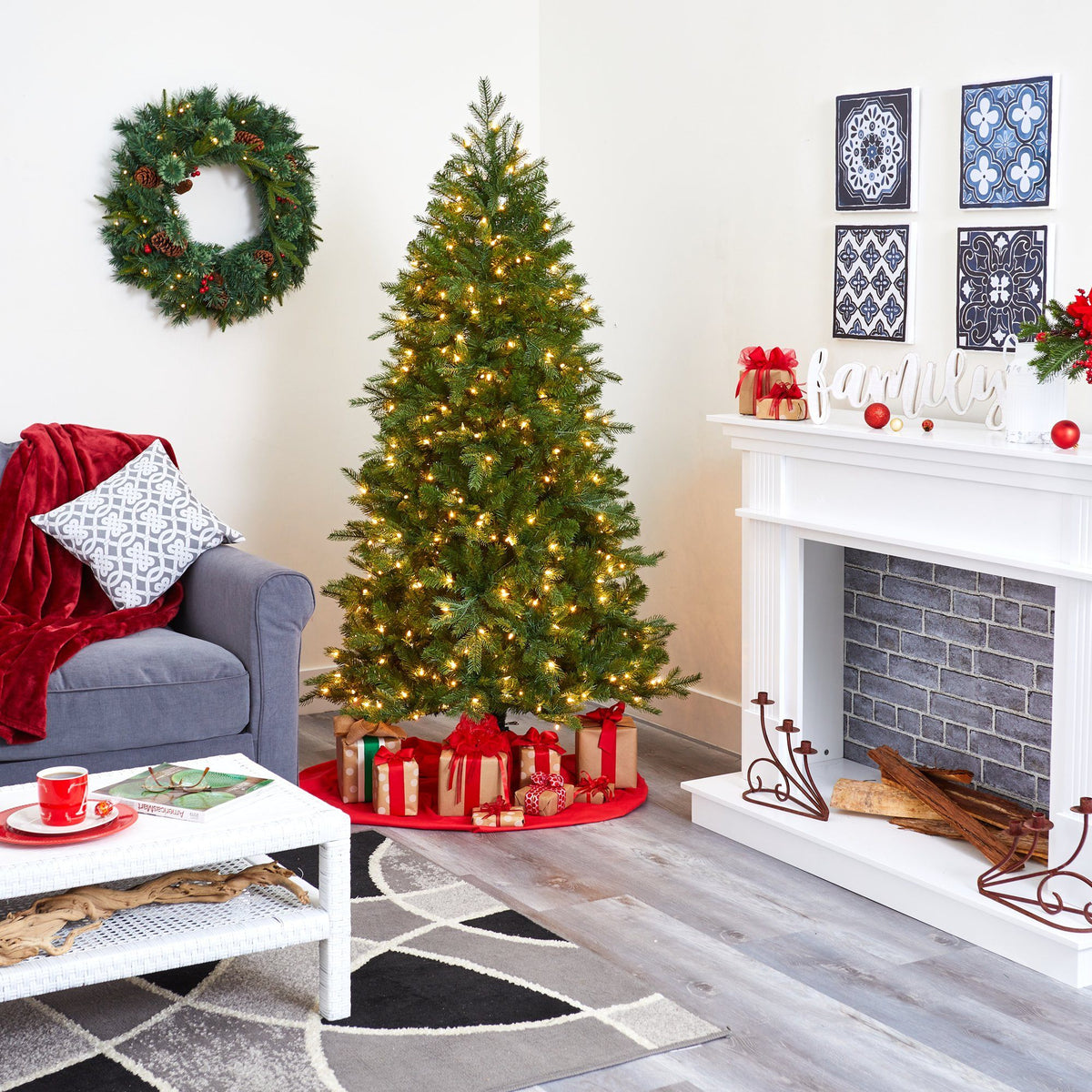a christmas tree with presents in a room