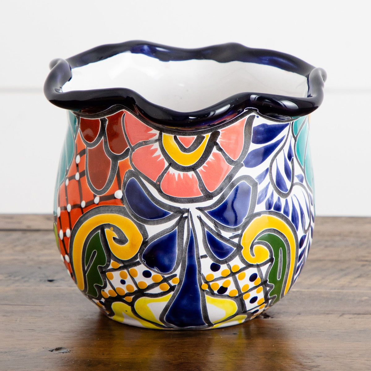 a colorful vase on a table