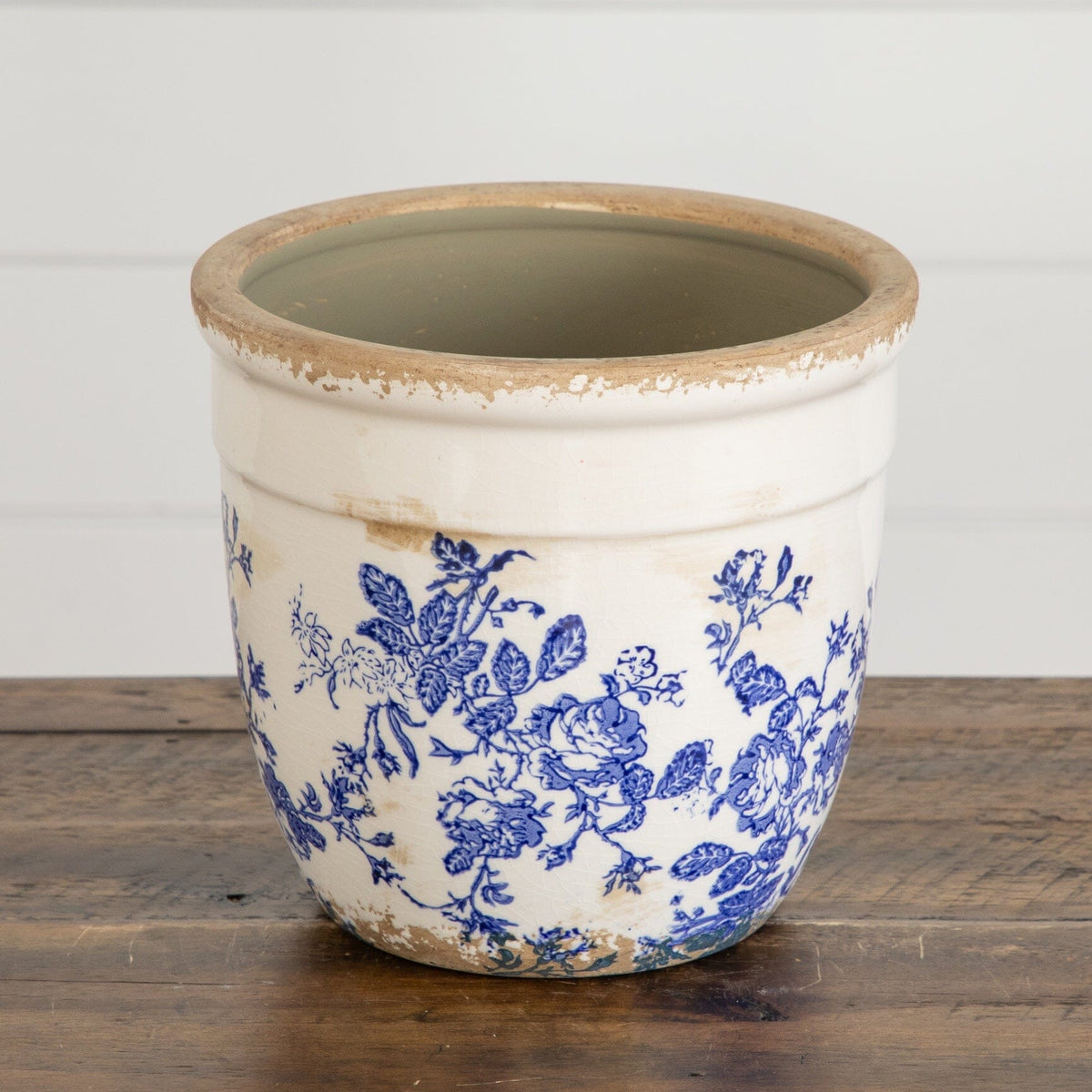 a white and blue flowered pot