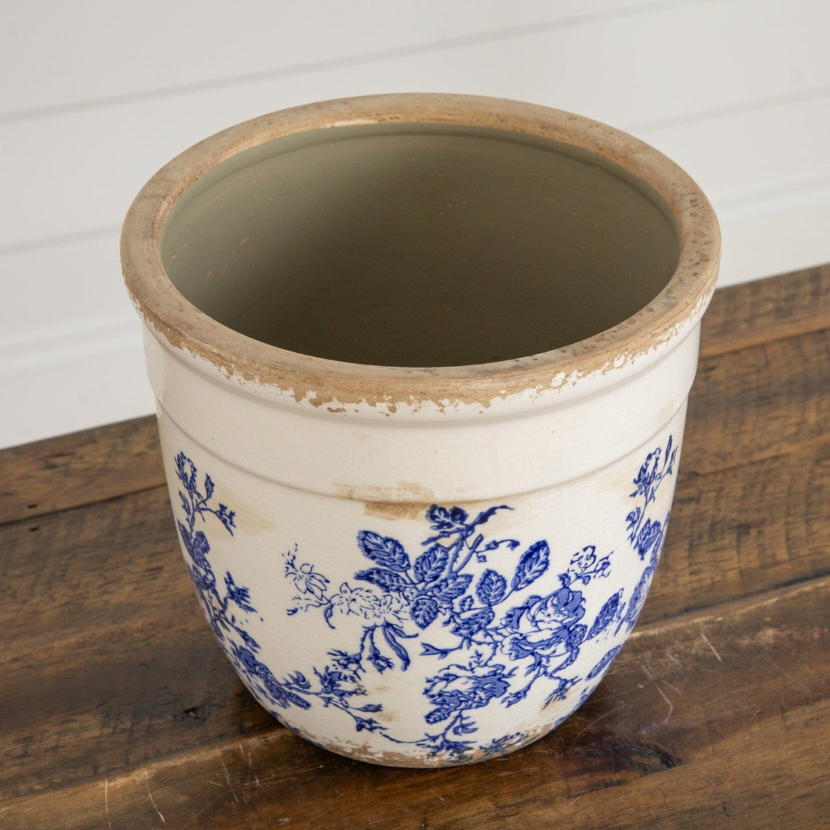 a white and blue flowered pot