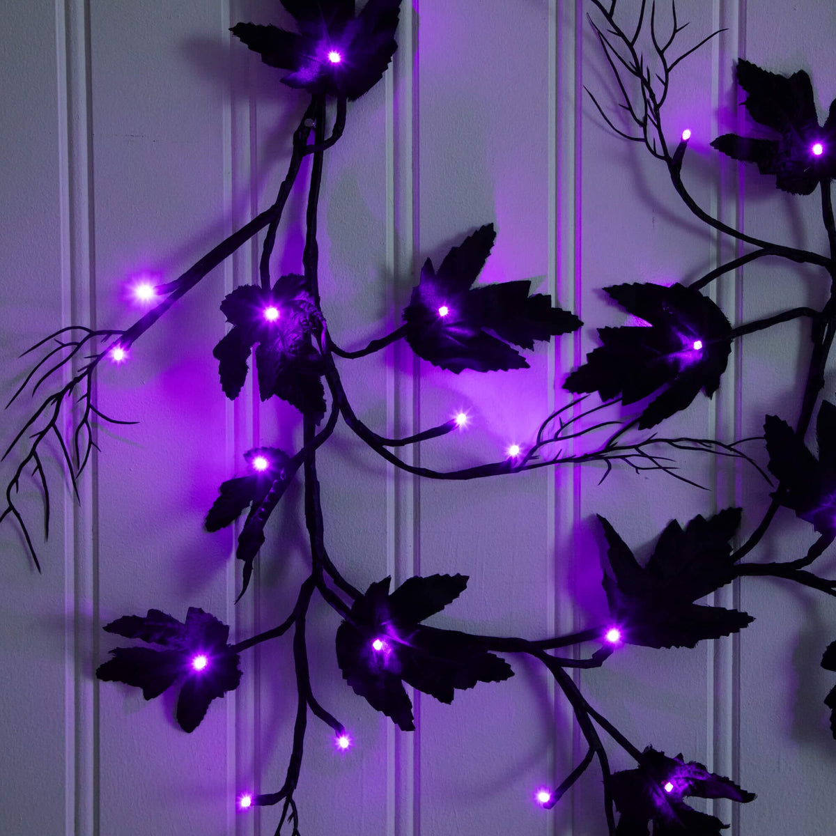 a purple lights on a white wall