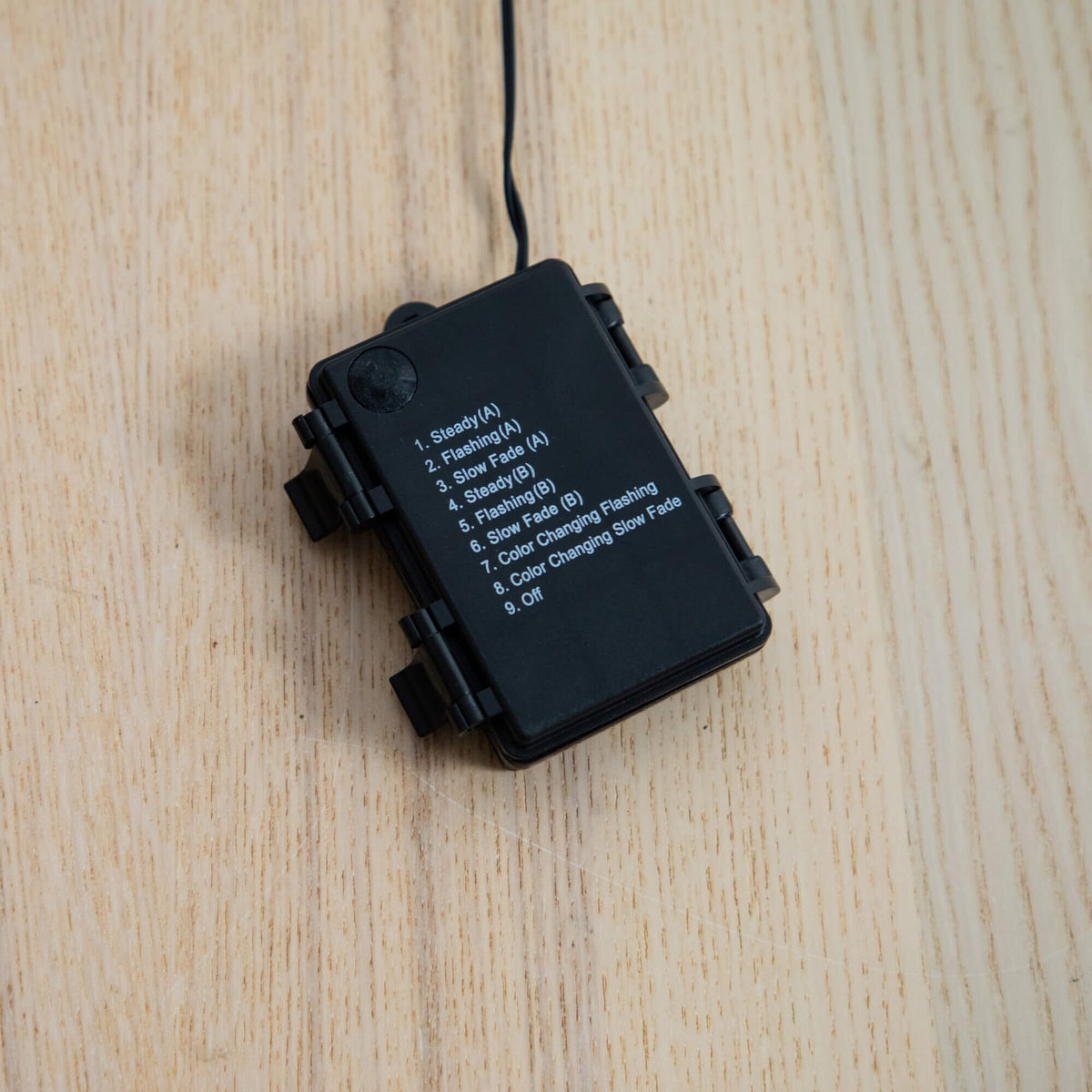 a black battery box with white text on it
