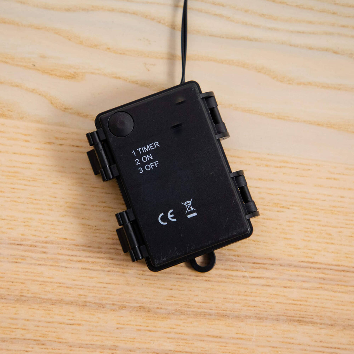 a black device with a wire