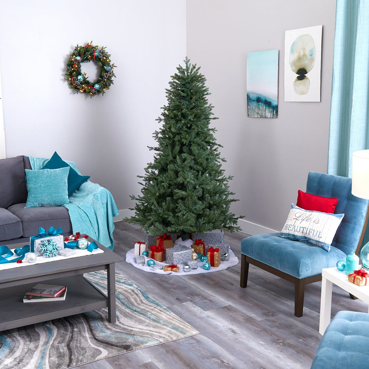 a living room with a christmas tree and a couch