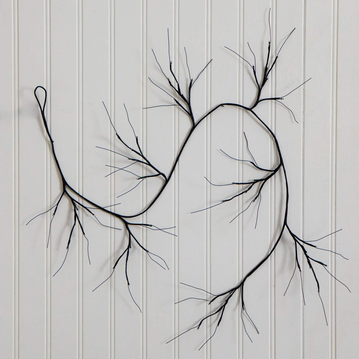 a black wire on a white wall