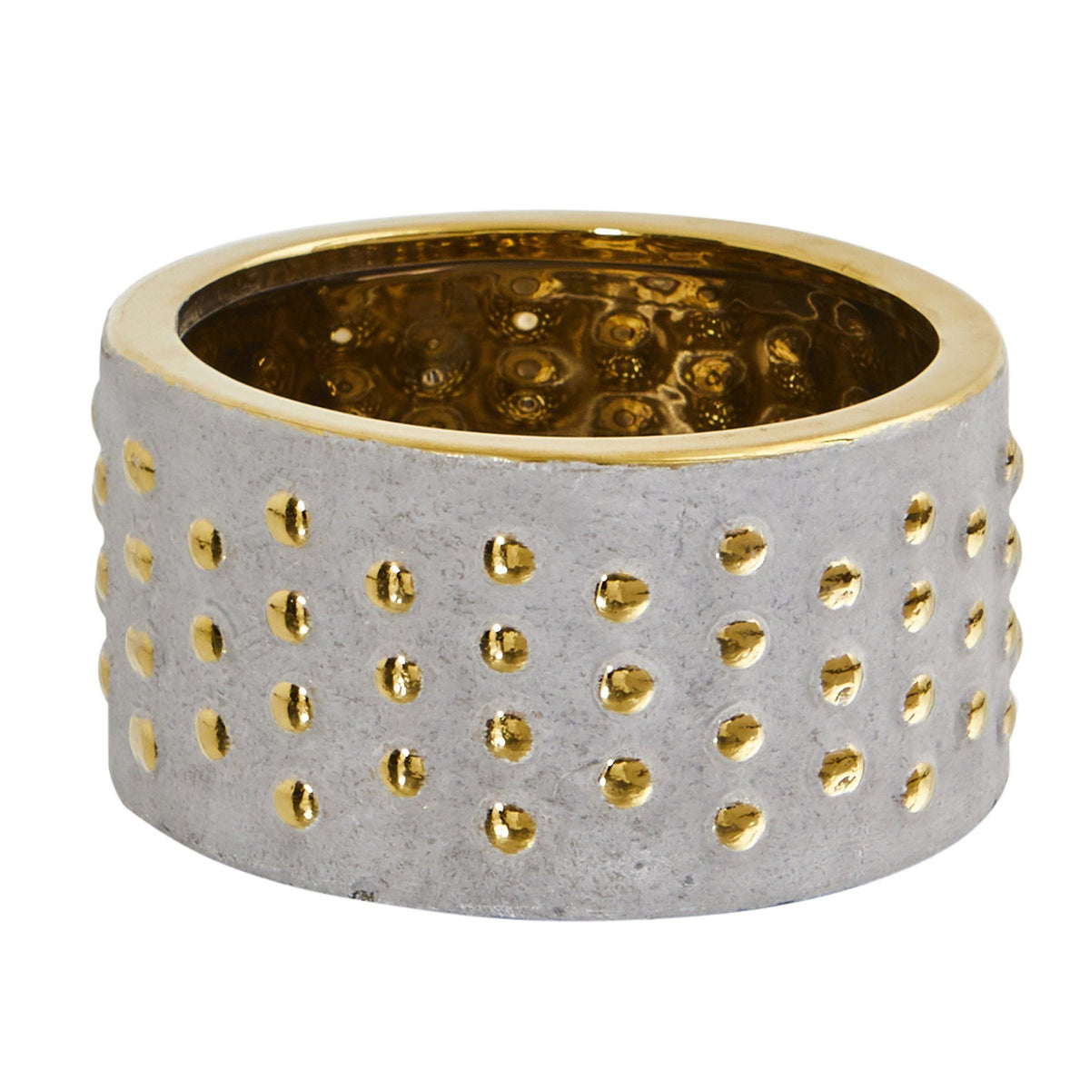 a silver and gold circular object