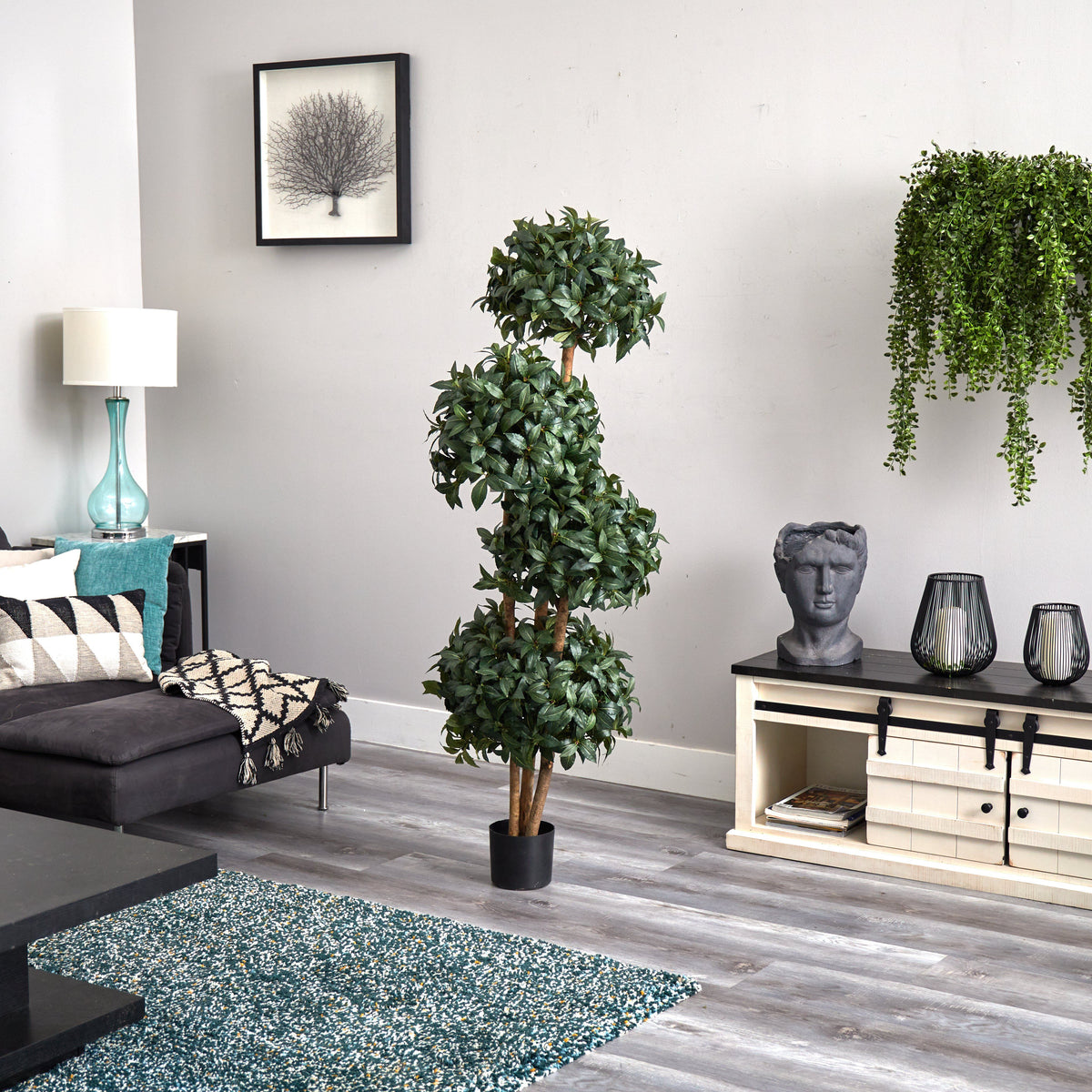 a living room with a plant and a couch
