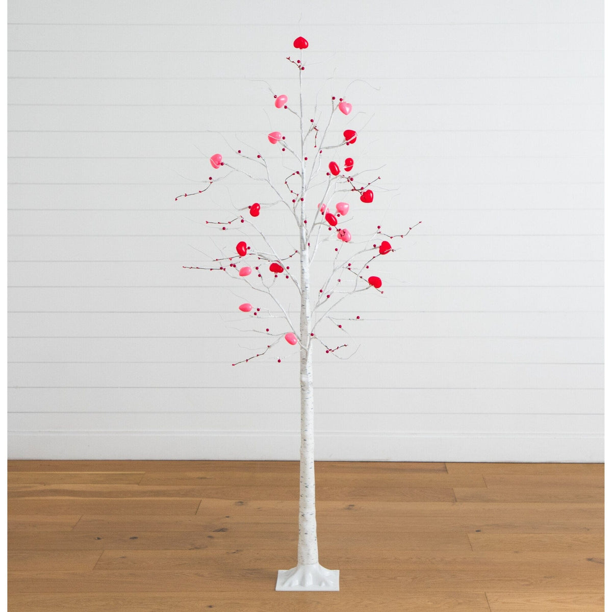 a tree with red flowers on it