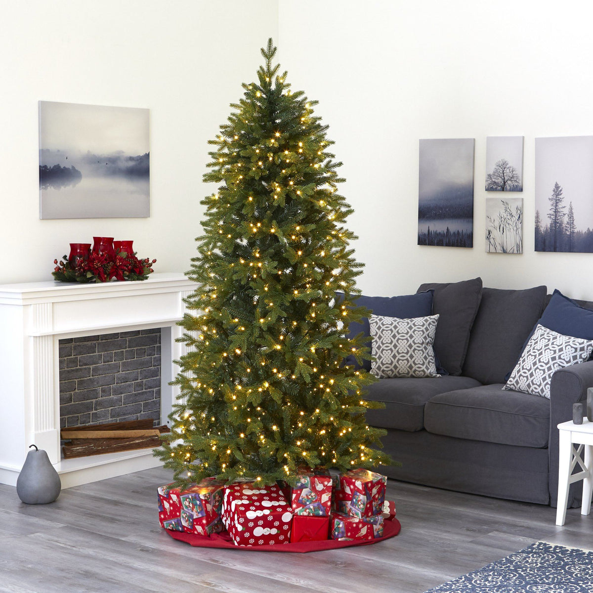 a christmas tree with presents in a room