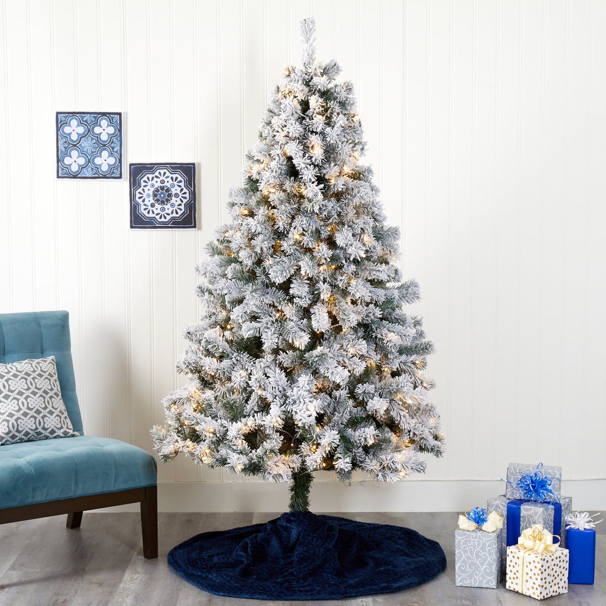 a christmas tree with lights and presents