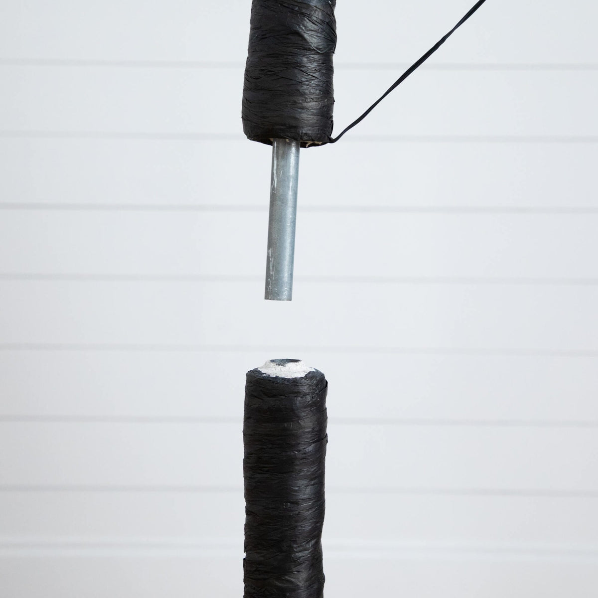 a spool of thread with a needle