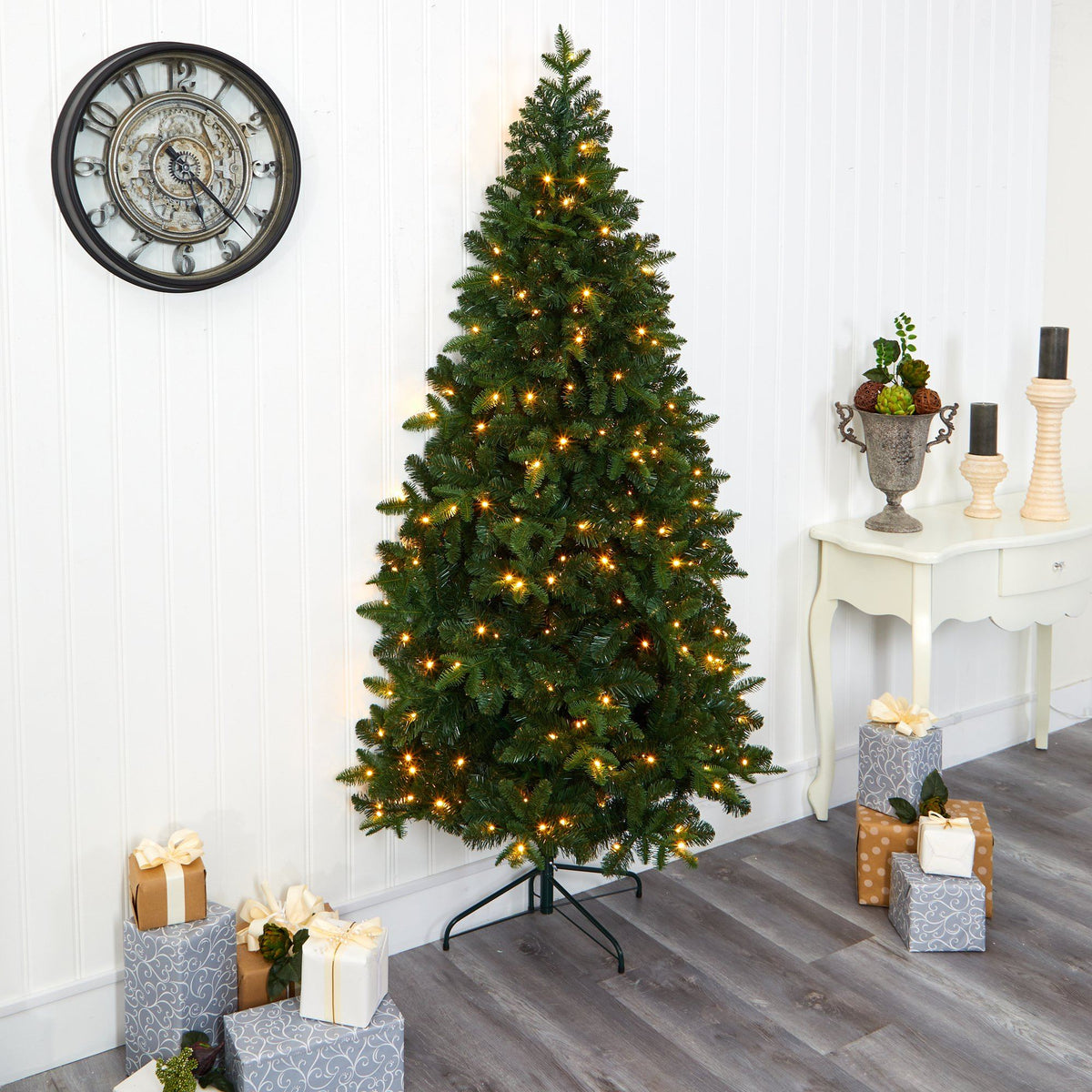 a christmas tree with lights and presents
