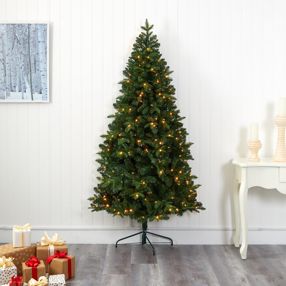 a christmas tree with lights and presents