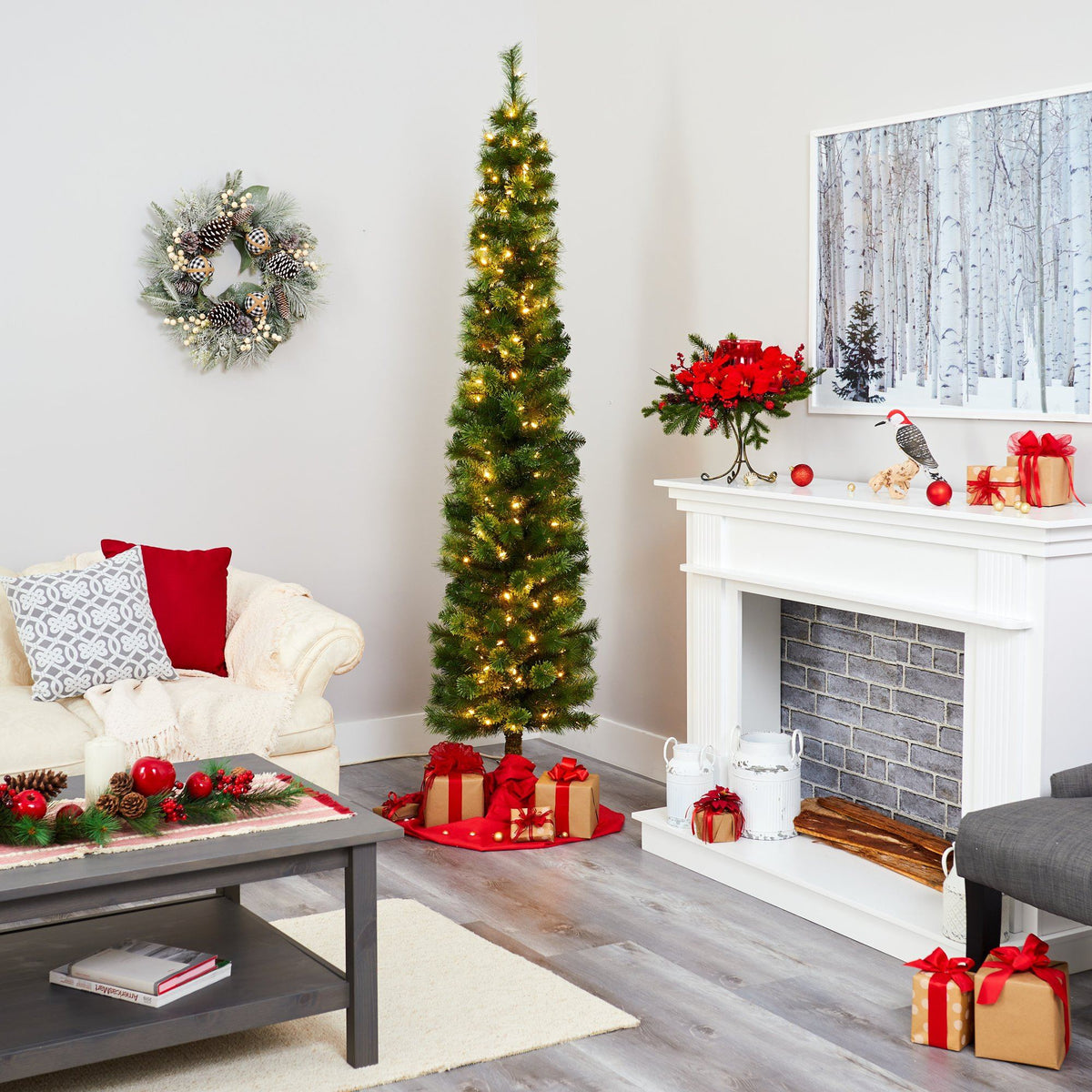 a living room with a christmas tree and fireplace