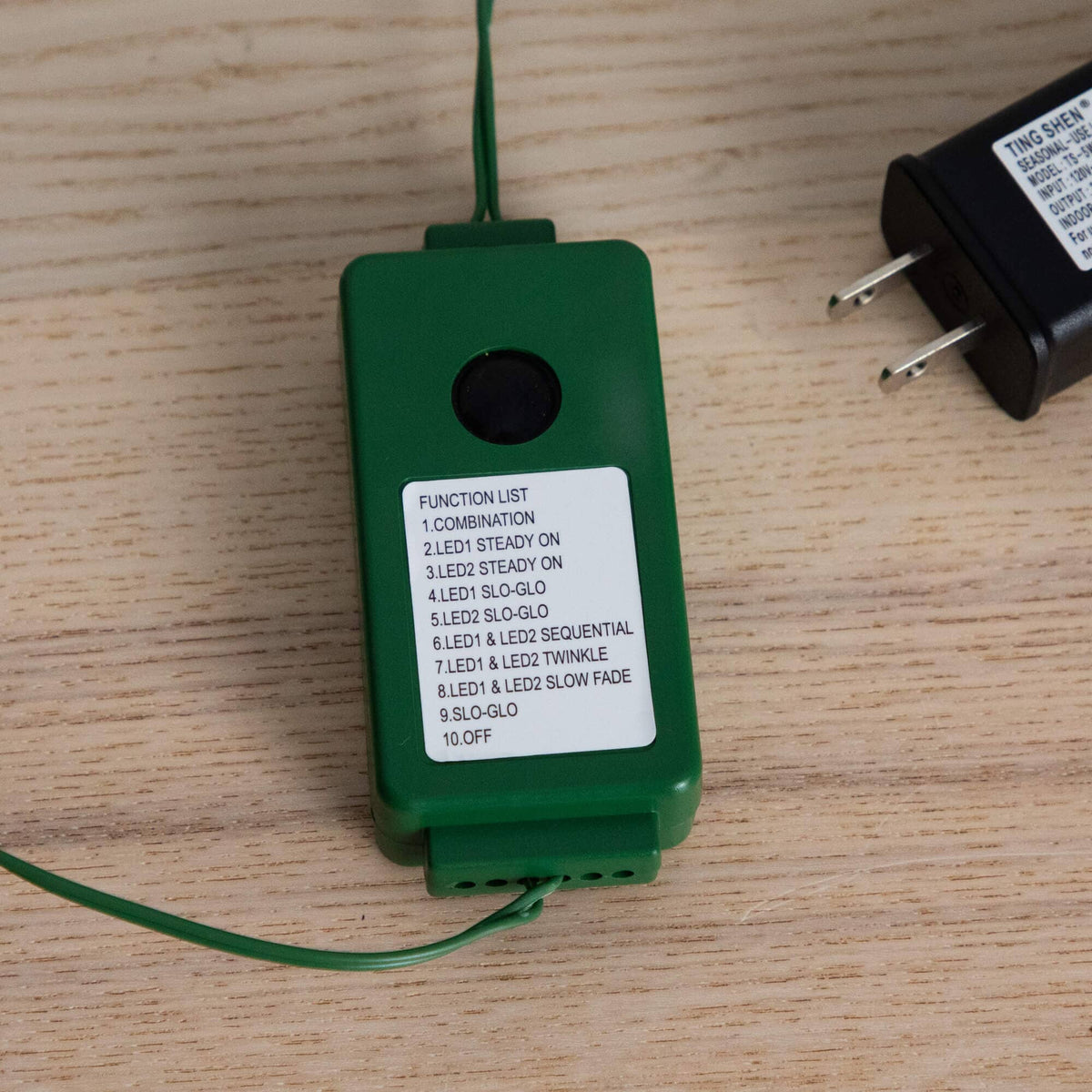 a green device with a white label