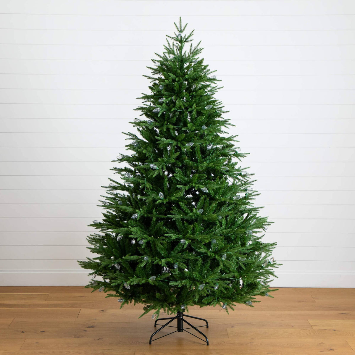 a christmas tree on a wood floor
