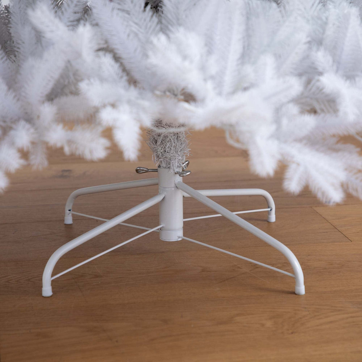 a white tree with a white base