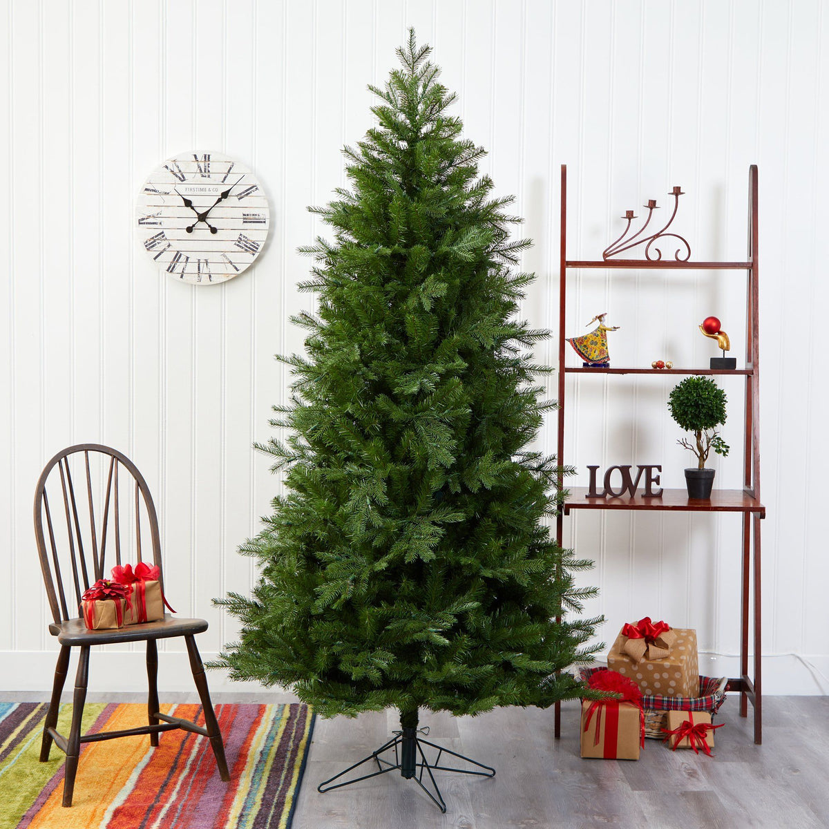 a christmas tree with presents and a shelf
